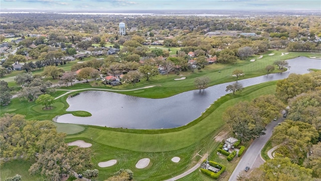 birds eye view of property featuring view of golf course and a water view