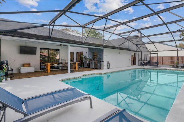 pool with a lanai, a patio area, ceiling fan, and fence