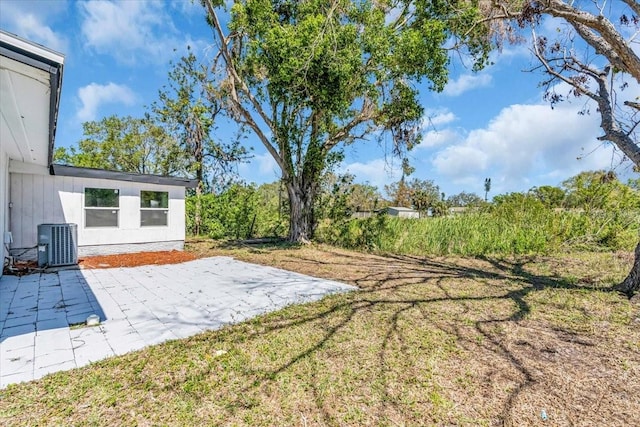 view of yard with a patio area and central AC unit