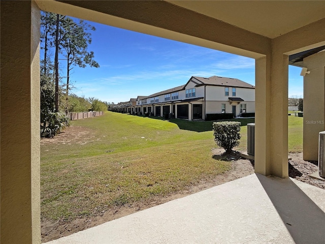 view of yard with cooling unit and a residential view