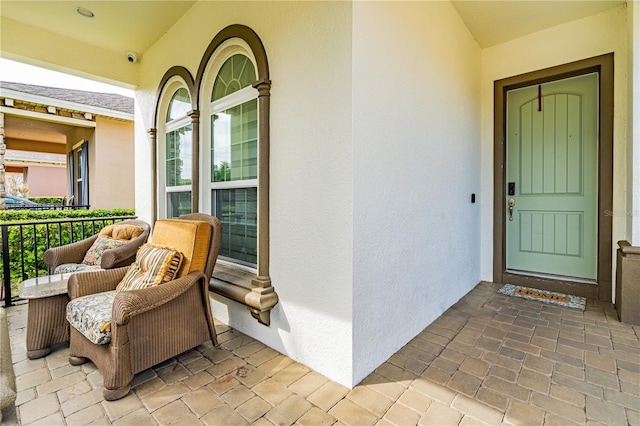 property entrance with stucco siding