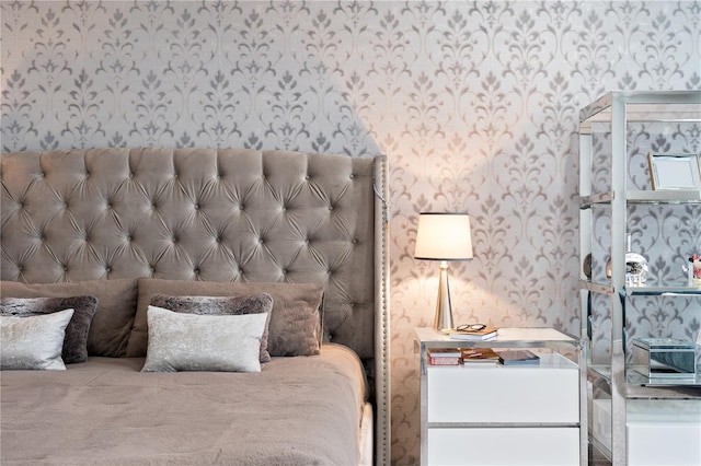 bedroom featuring wallpapered walls