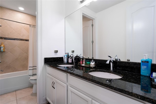 bathroom with tile patterned flooring, a sink, shower / bathtub combination with curtain, and toilet