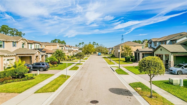 view of road featuring sidewalks, a residential view, and curbs