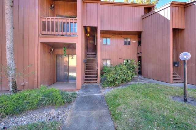 974 E Michigan St Unit 974, Orlando, FL 32806 - view of exterior entry featuring a lawn