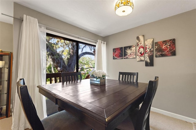 dining area with carpet flooring and baseboards