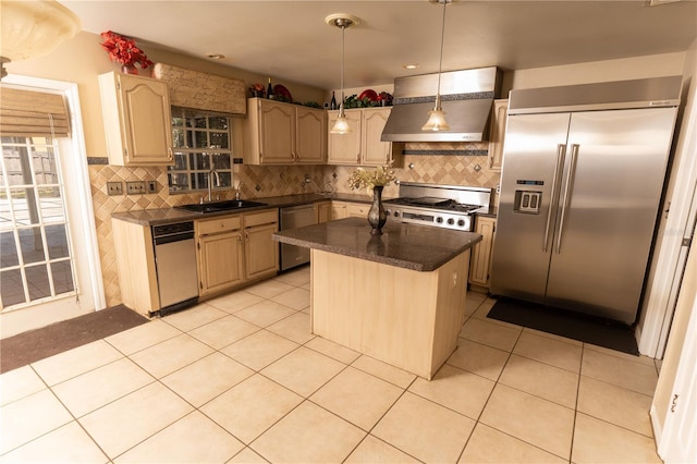 kitchen with dark countertops, premium range hood, dishwasher, high quality fridge, and a sink