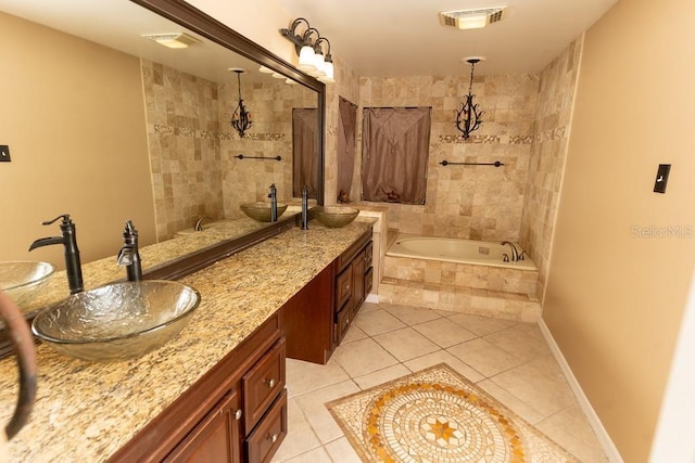 bathroom featuring tile patterned flooring, visible vents, and double vanity