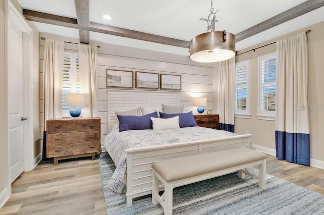 bedroom featuring baseboards, coffered ceiling, beamed ceiling, light wood-type flooring, and recessed lighting