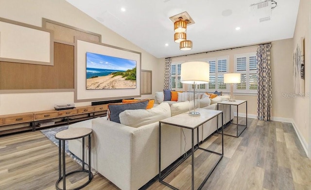 living room featuring light wood-type flooring, lofted ceiling, baseboards, and recessed lighting