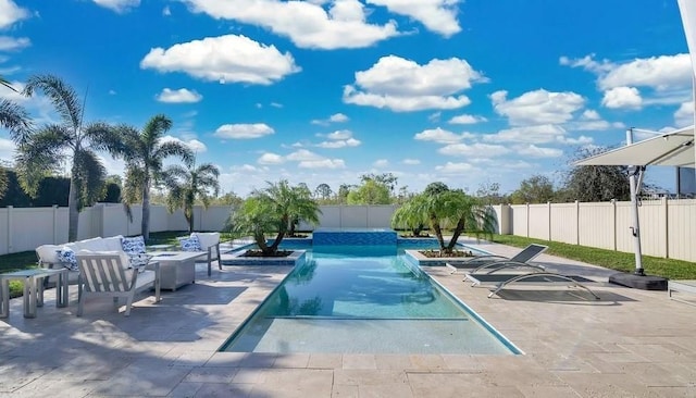 view of swimming pool featuring a patio area, a fenced backyard, and a fenced in pool