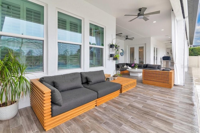 exterior space with ceiling fan, french doors, and an outdoor living space