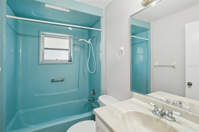 bathroom featuring shower / bathing tub combination, vanity, and toilet