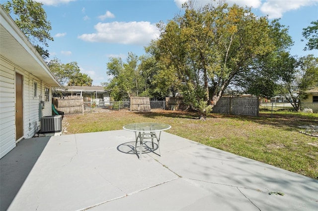 view of patio / terrace with central air condition unit and fence