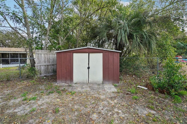 view of shed with a fenced backyard