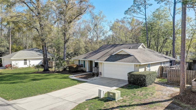 ranch-style home featuring driveway, an attached garage, a front lawn, and fence