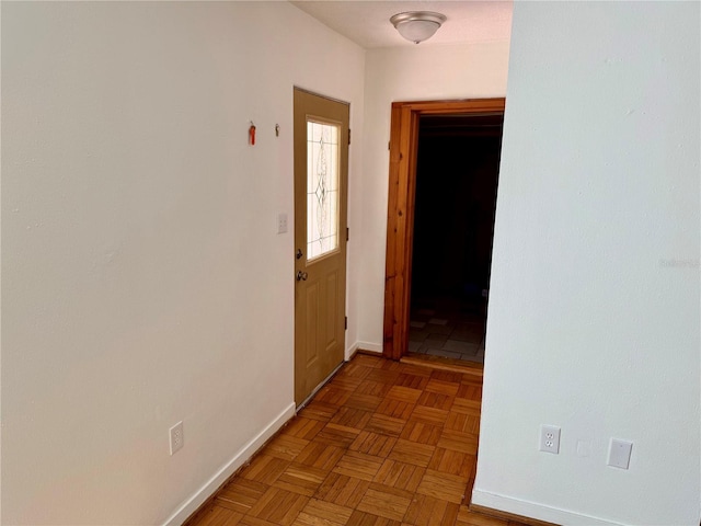 hallway featuring baseboards