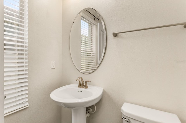 bathroom with a sink and toilet