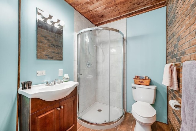 full bathroom with brick wall, toilet, a stall shower, wooden ceiling, and vanity