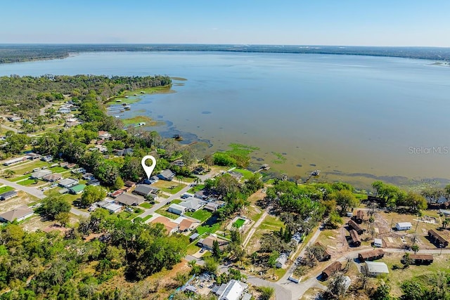 birds eye view of property with a residential view and a water view