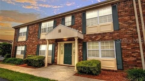 view of front of home featuring brick siding