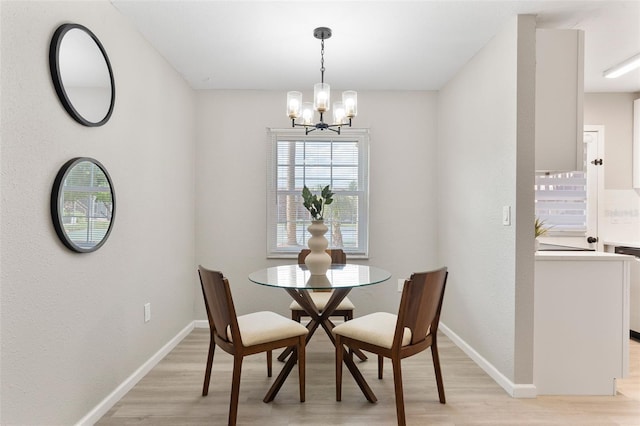1920 E Edgewood Dr Unit A5, Lakeland, FL 33803 - dining area featuring light wood finished floors and a chandelier