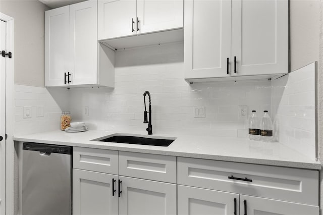 1920 E Edgewood Dr Unit A5, Lakeland, FL 33803 - kitchen with stainless steel dishwasher, decorative backsplash, and white cabinets