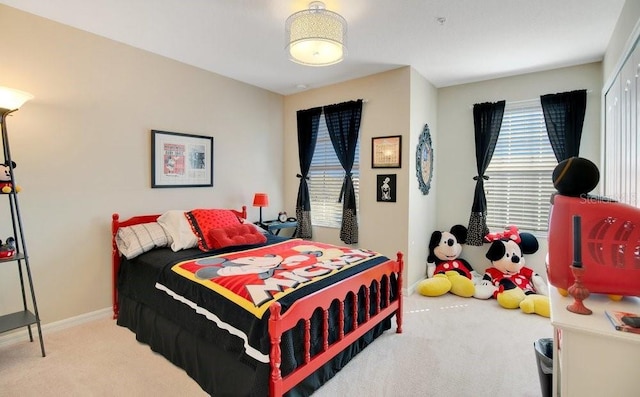 bedroom with baseboards and carpet floors