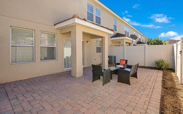 view of patio / terrace featuring central air condition unit and a fenced backyard