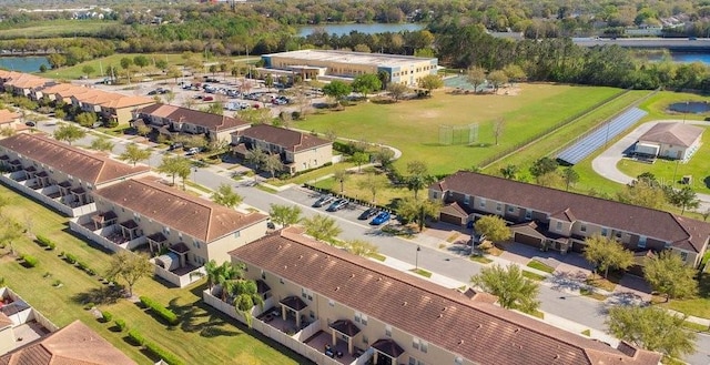 aerial view with a residential view and a water view