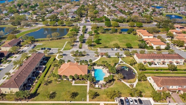 birds eye view of property featuring a residential view and a water view