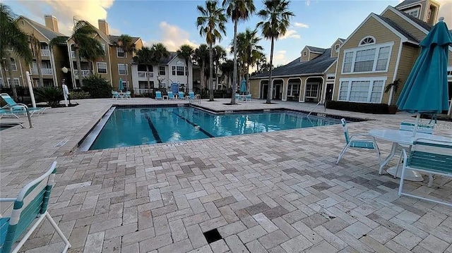 community pool with a patio area