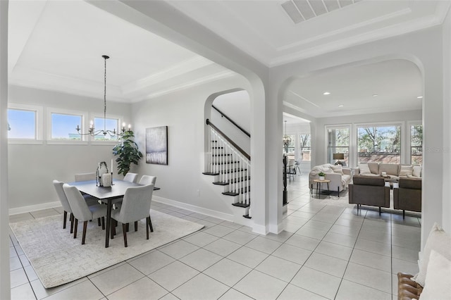 dining area featuring a chandelier, light tile patterned flooring, ornamental molding, and stairs