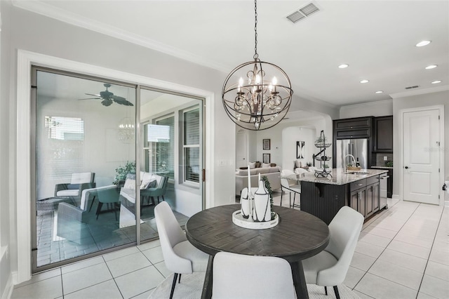 dining room featuring light tile patterned floors, recessed lighting, visible vents, ornamental molding, and ceiling fan with notable chandelier