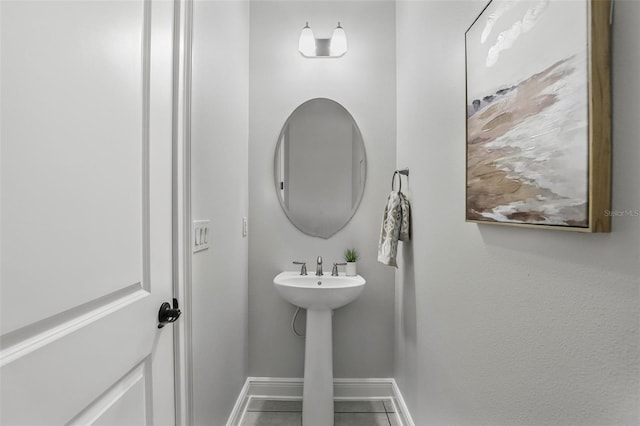 bathroom featuring baseboards and tile patterned floors