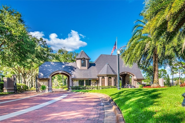 view of front of house featuring a front yard and stone siding