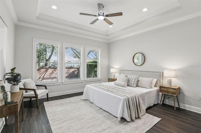 1377 Tappie Toorie Cir, Lake Mary, FL 32746 - bedroom with a tray ceiling, dark wood finished floors, baseboards, crown molding, and recessed lighting