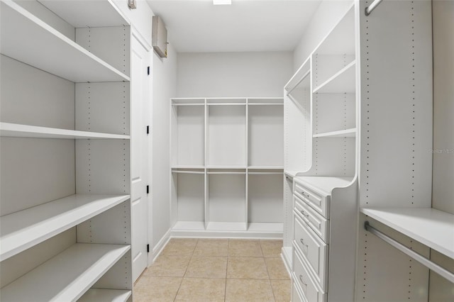 1377 Tappie Toorie Cir, Lake Mary, FL 32746 - walk in closet featuring light tile patterned floors
