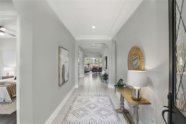 1377 Tappie Toorie Cir, Lake Mary, FL 32746 - hall featuring arched walkways, crown molding, light tile patterned floors, and recessed lighting