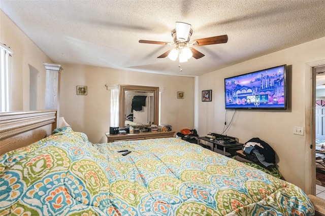 bedroom featuring a textured ceiling and ceiling fan