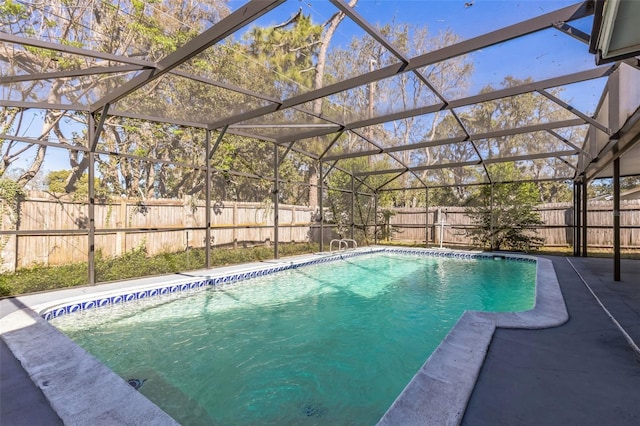 view of pool featuring a lanai, a fenced in pool, a patio, and a fenced backyard