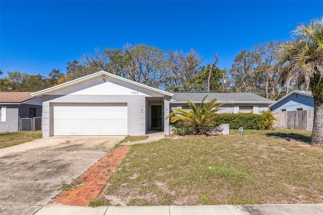 ranch-style house with stucco siding, a front lawn, driveway, fence, and an attached garage