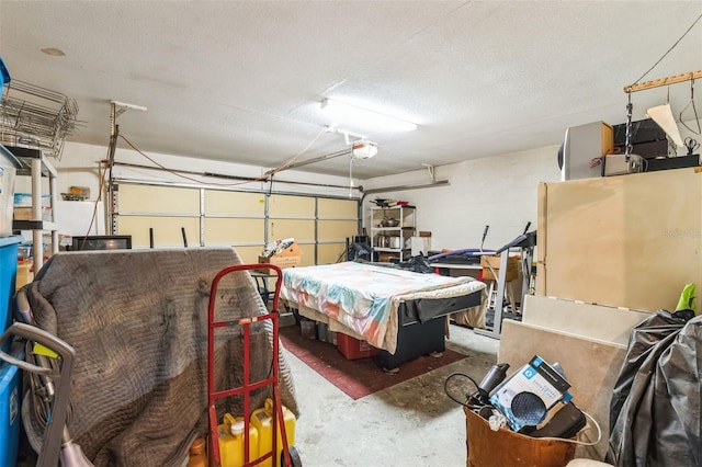 garage with concrete block wall and a garage door opener