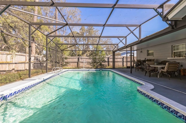 view of swimming pool with a patio area, a fenced in pool, a lanai, and a fenced backyard