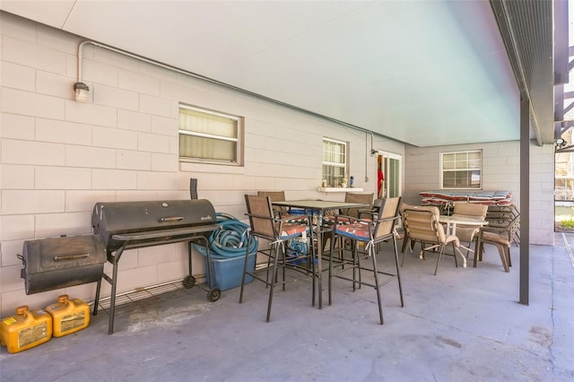 view of patio with outdoor dining area and area for grilling