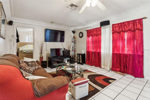 tiled living area featuring visible vents and ceiling fan