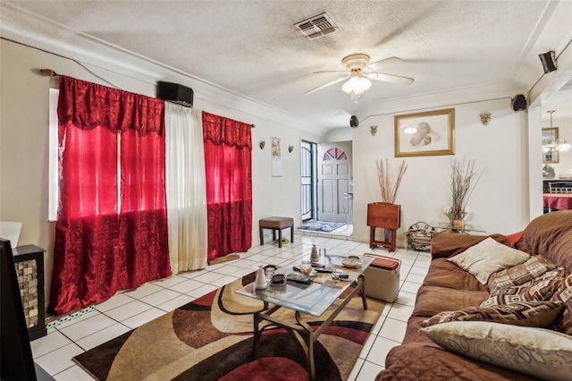 tiled living area with ceiling fan, crown molding, visible vents, and a textured ceiling