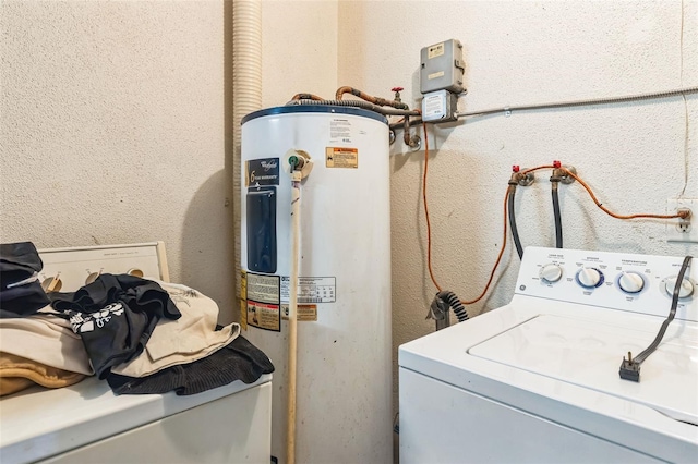 laundry room with washer / dryer, a textured wall, water heater, and laundry area