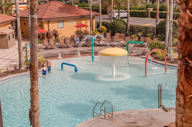 view of swimming pool with a patio