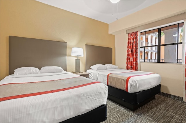 bedroom featuring ceiling fan and carpet flooring